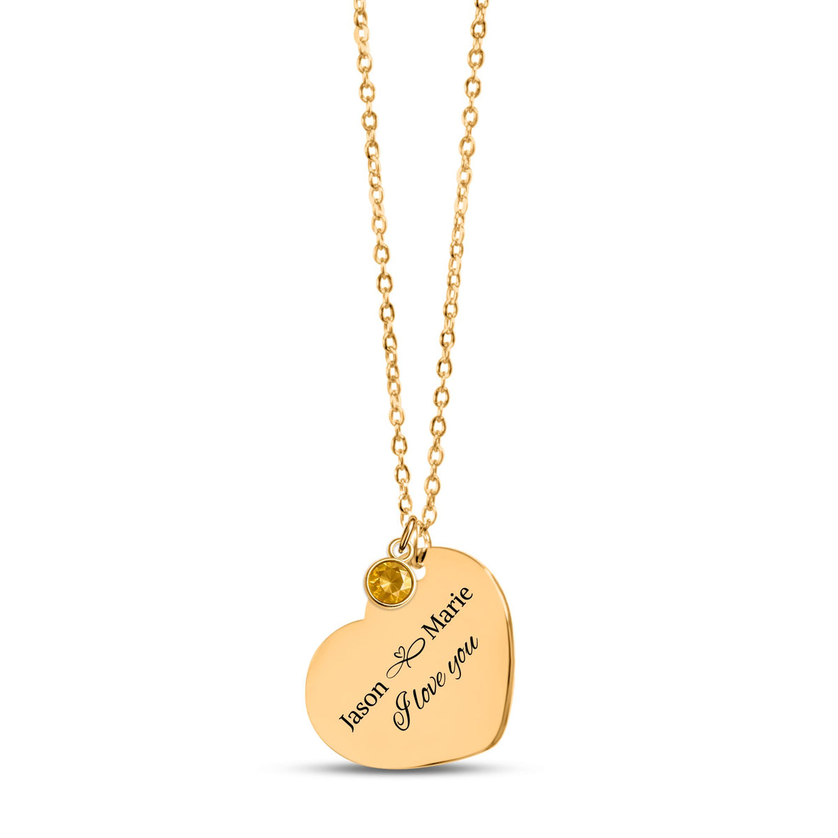 De gouden hartketting met geboortesteen, in de vingers gehouden