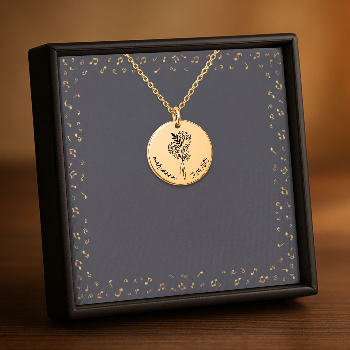 De muntketting in goud, in een geschenkdoosje