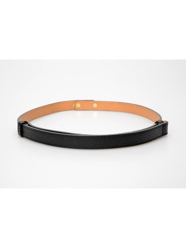 De zwarte riem van de achterkant, met de naturelkleurige binnenzijde