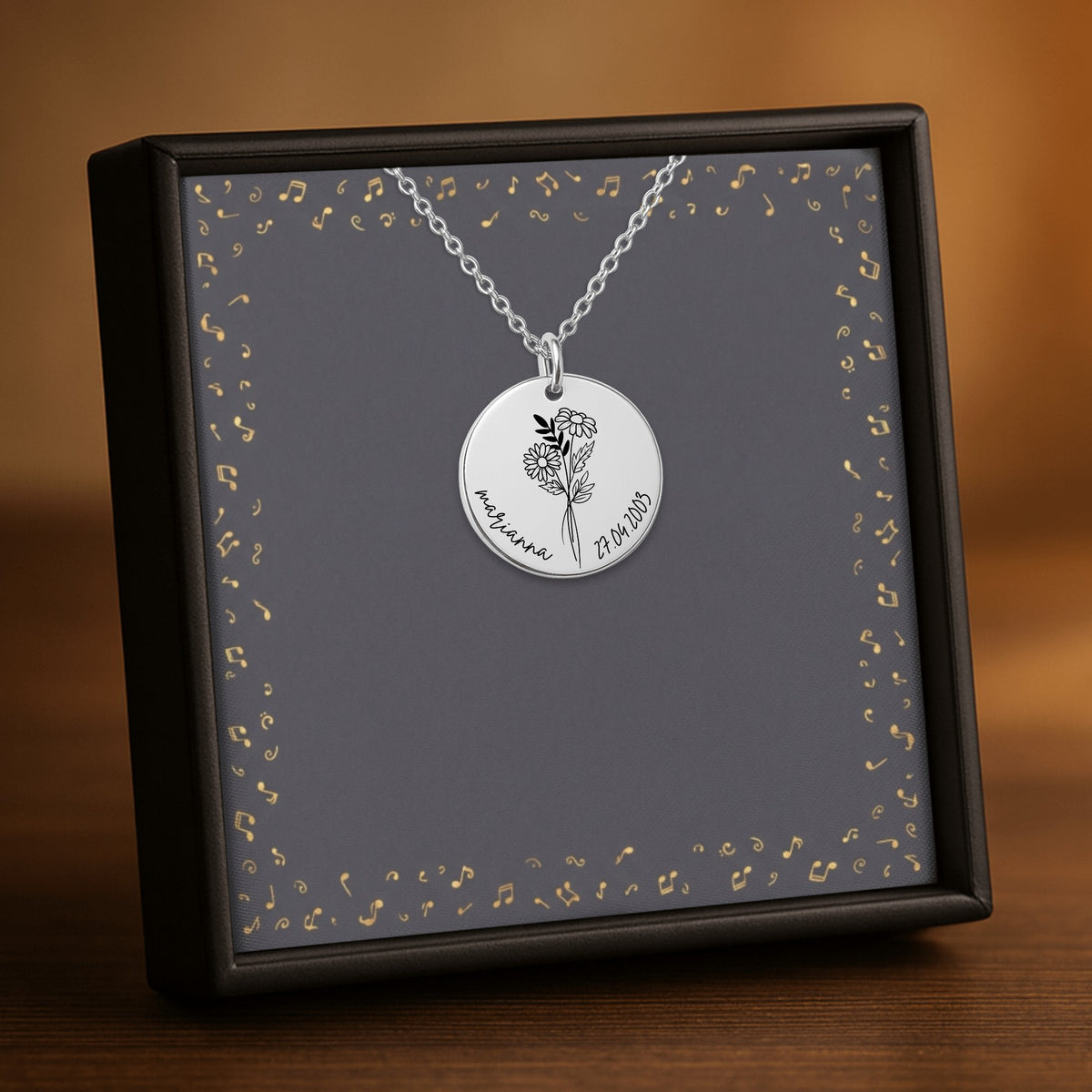 De muntketting in zilverkleur, in een geschenkdoosje